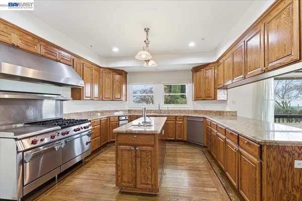 a view of a bedroom with furniture and white cabinet