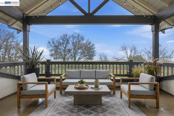 a bedroom with a large bed and a potted plant