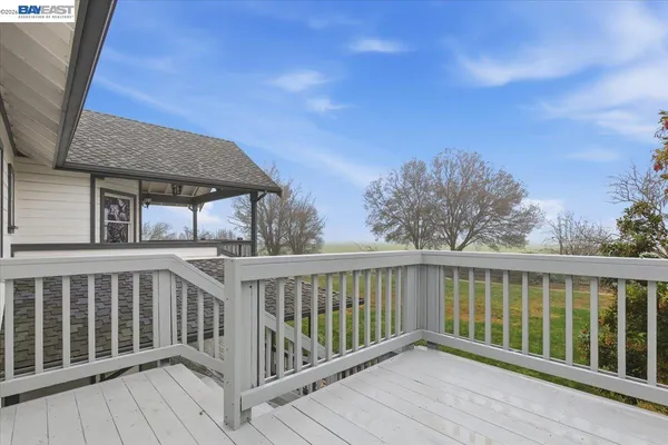 a bedroom with a bed couch and window