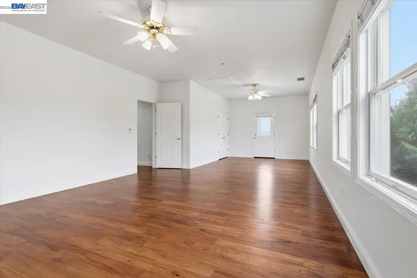 a bedroom with a bed couch and window