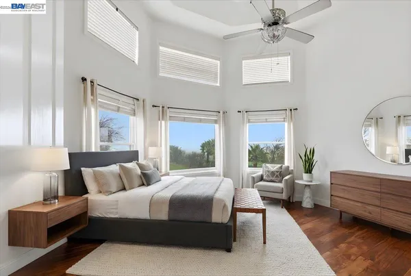a living room with lots of furniture and a view of the lobby