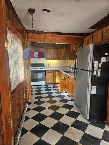 a view of a storage & utility room with a sink