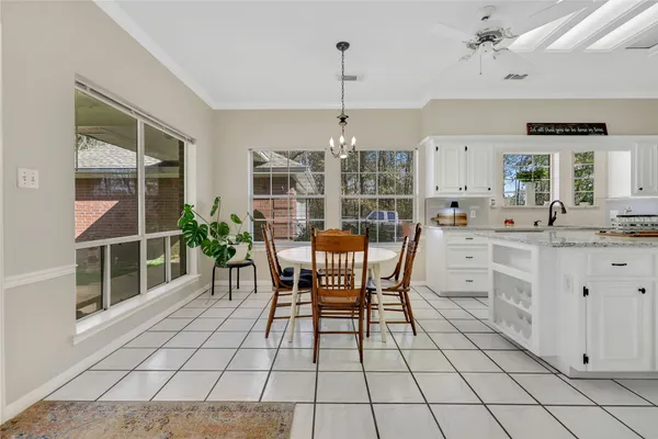 a spacious bathroom with a glass door shower and a sink