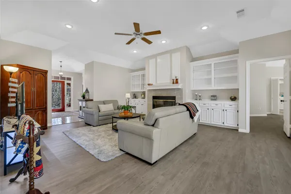a living room with furniture and a fireplace