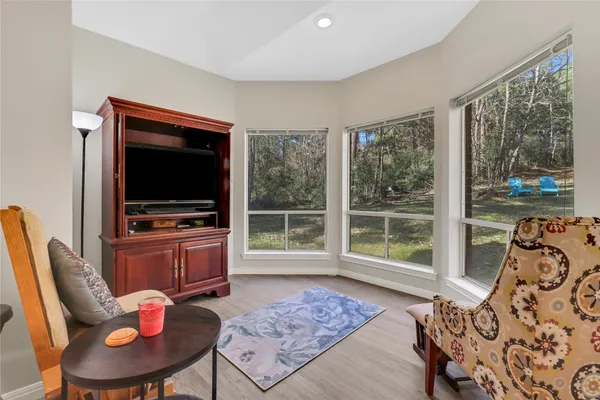 a bedroom with furniture and a window