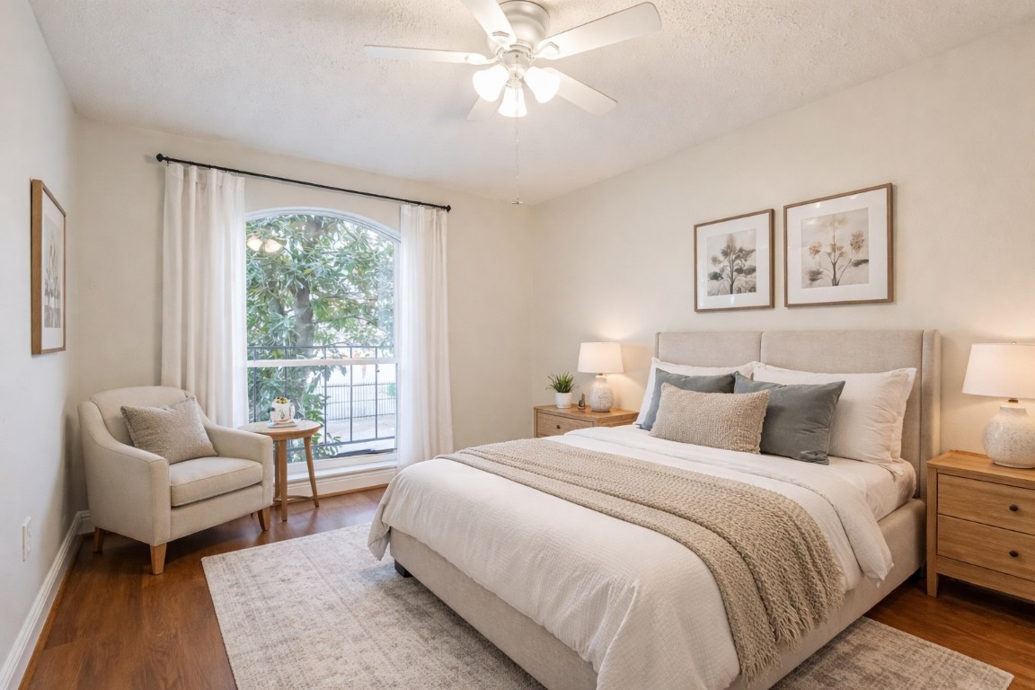7575 Katy Freeway, Unit 101 Houston, TX 77024 - Photo 13 of 21 a bedroom with a bed and a couch
