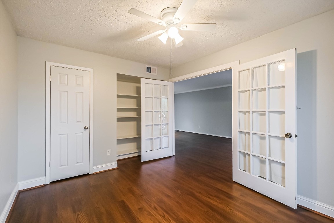 7575 Katy Freeway, Unit 101 Houston, TX 77024 - Photo 14 of 21 wooden floor in an empty room with a window