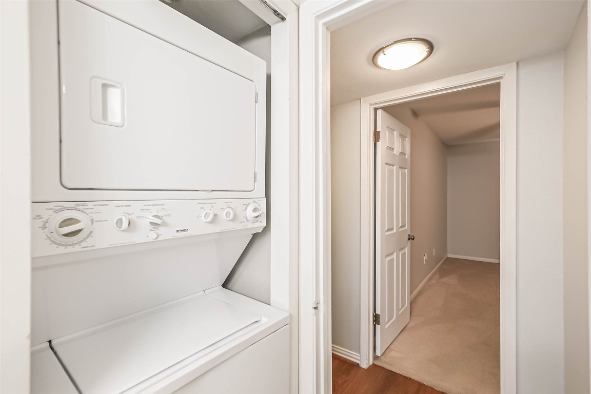7575 Katy Freeway, Unit 101 Houston, TX 77024 - Photo 16 of 21 a view of a hallway with washer and dryer