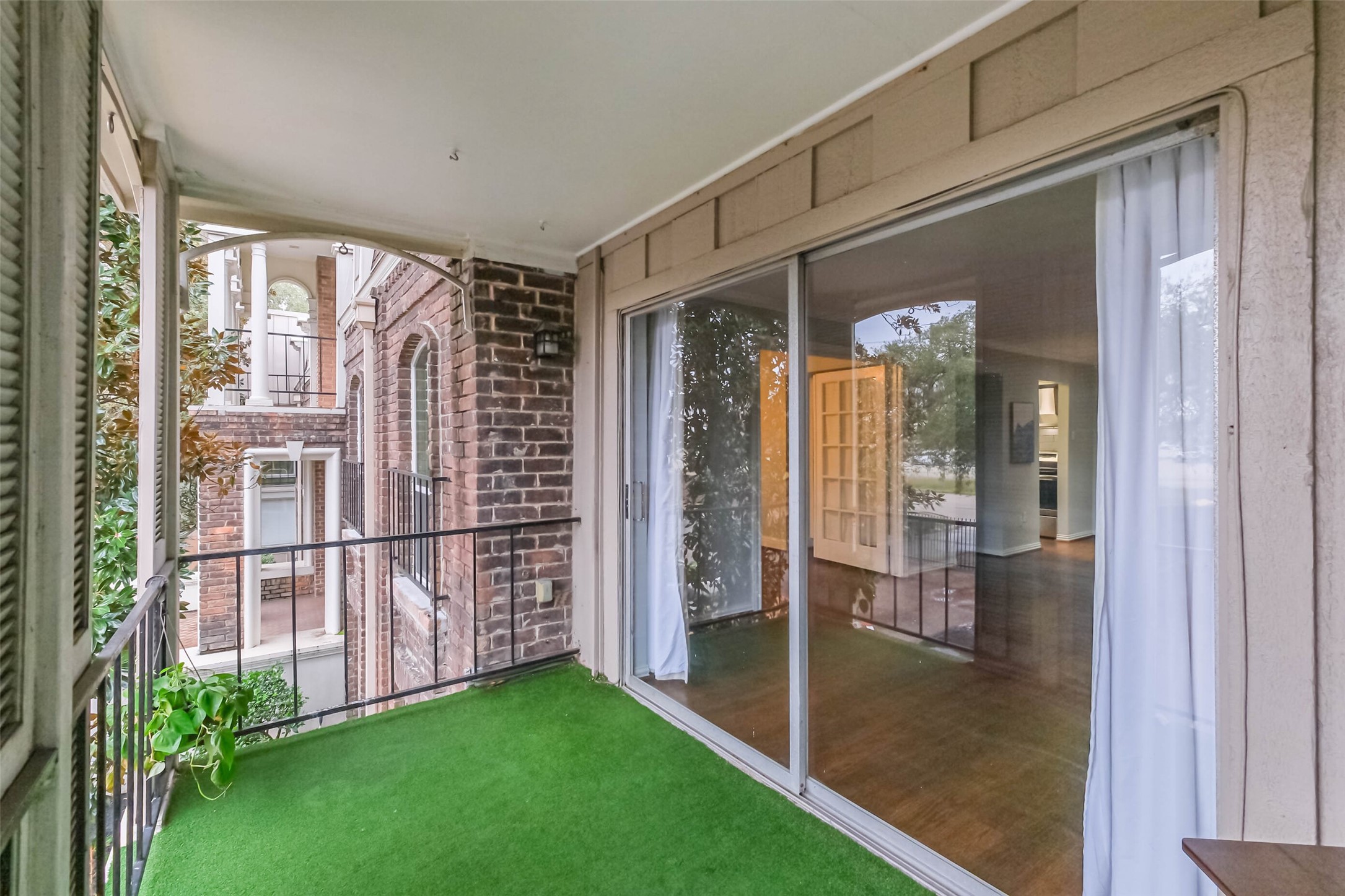 7575 Katy Freeway, Unit 101 Houston, TX 77024 - Photo 18 of 21 Enjoy outside space with sliding glass doors.