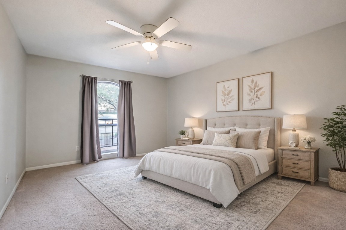 7575 Katy Freeway, Unit 101 Houston, TX 77024 - Photo 2 of 21 a bedroom with a large bed and a chandelier