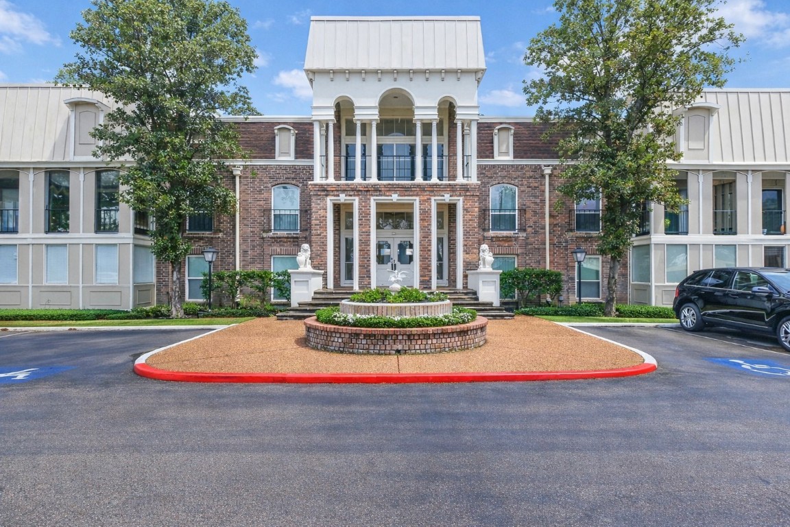 7575 Katy Freeway, Unit 101 Houston, TX 77024 - Photo 3 of 21 a front view of house with yard and green space