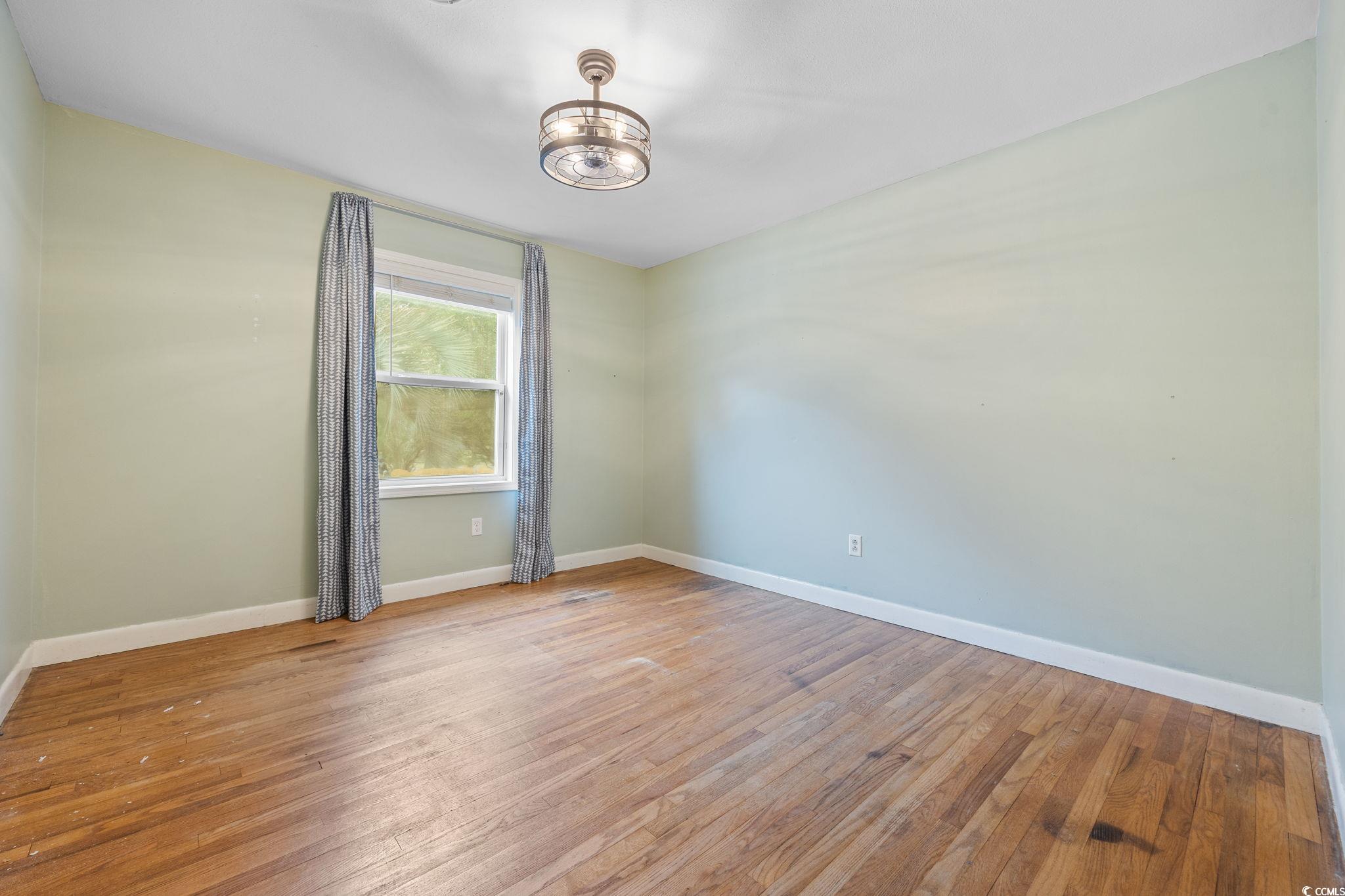 4303 Old Kings Highway Murrells Inlet, SC 29576 - Photo 14 of 34 Spare room featuring light wood-style floors and healthy amount of natural light