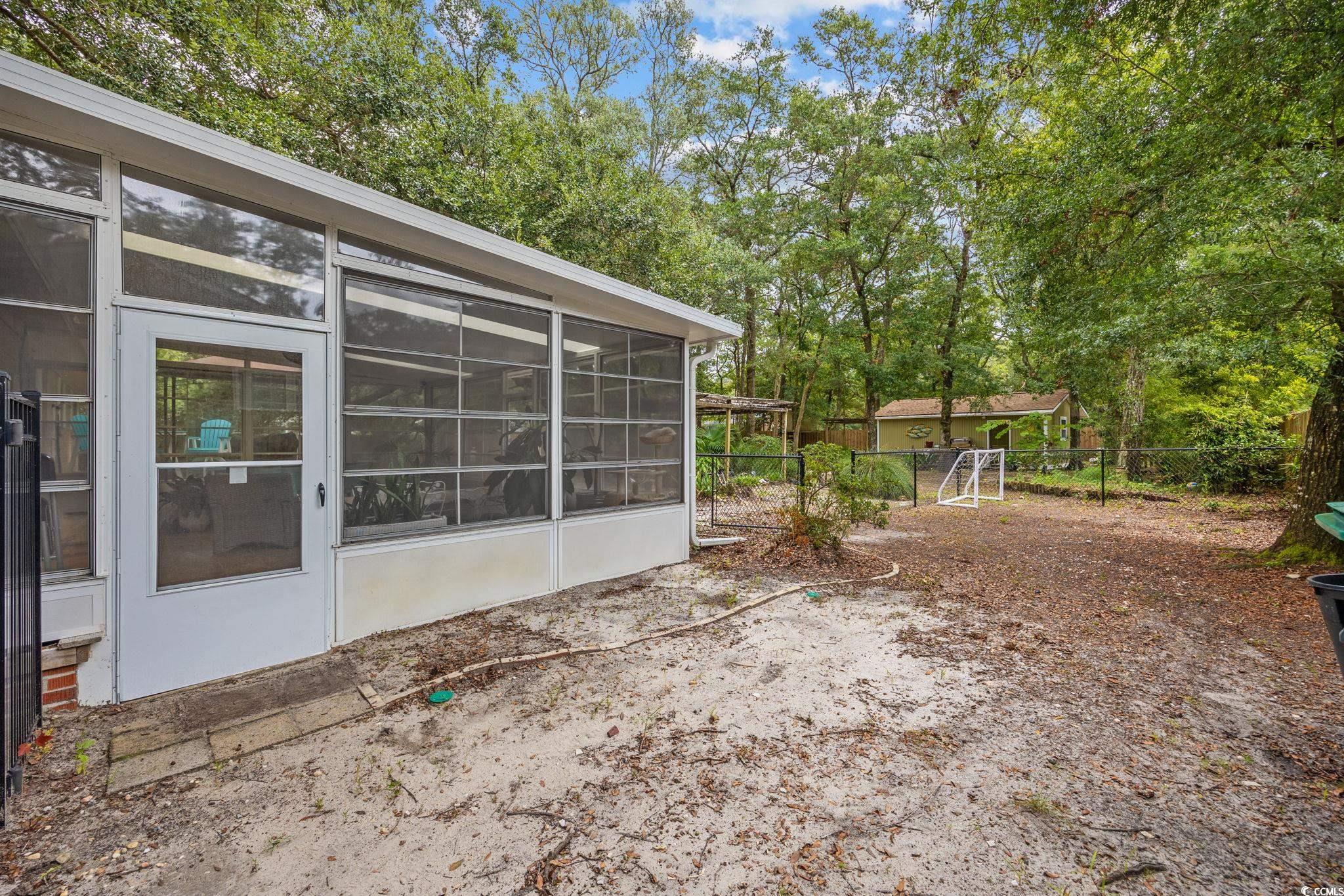 4303 Old Kings Highway Murrells Inlet, SC 29576 - Photo 21 of 34 Sunroom with plenty of natural light, ceiling fan, and outdoor lounge area