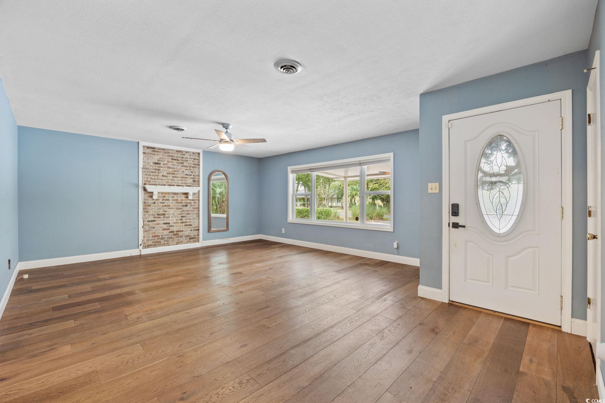 4303 Old Kings Highway Murrells Inlet, SC 29576 - Photo 4 of 34 Foyer with wood-type flooring and a ceiling fan