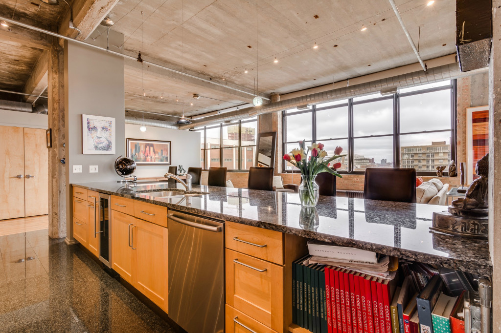 850 West Adams Street, Unit 6D Chicago, IL 60607 - Photo 12 of 35 a kitchen with lots of counter top space and wooden floor
