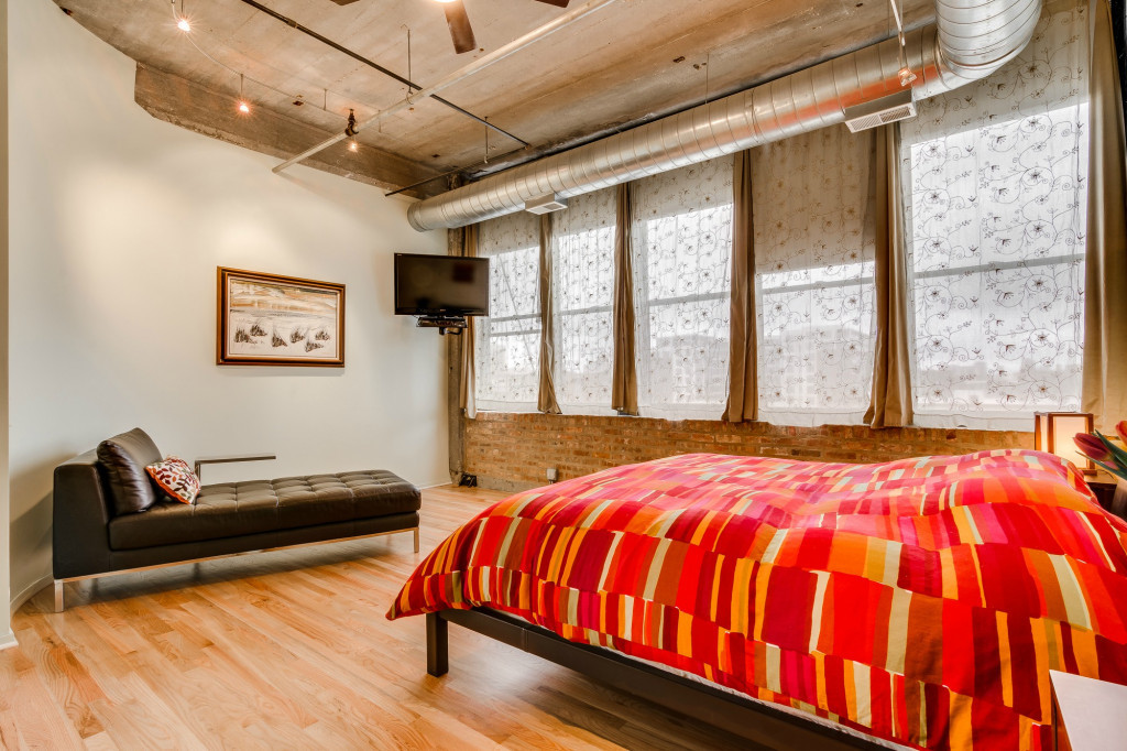 850 West Adams Street, Unit 6D Chicago, IL 60607 - Photo 21 of 35 a bedroom with a bed and wooden floor