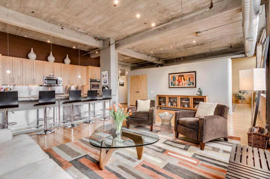 850 West Adams Street, Unit 6D Chicago, IL 60607 - Photo 7 of 35 a living room with couches and kitchen view with wooden floor
