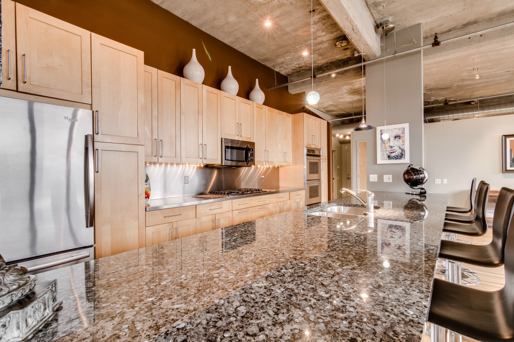 850 West Adams Street, Unit 6D Chicago, IL 60607 - Photo 8 of 35 a kitchen with stainless steel appliances granite countertop a refrigerator a stove and a sink