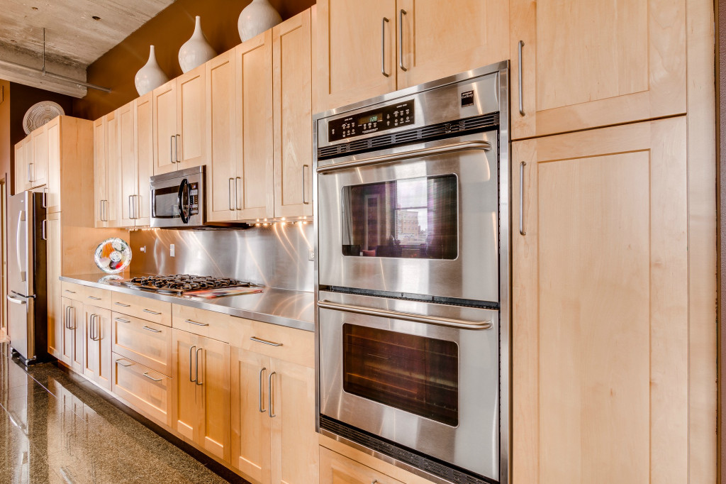 850 West Adams Street, Unit 6D Chicago, IL 60607 - Photo 10 of 35 a kitchen with granite countertop a stove microwave and sink