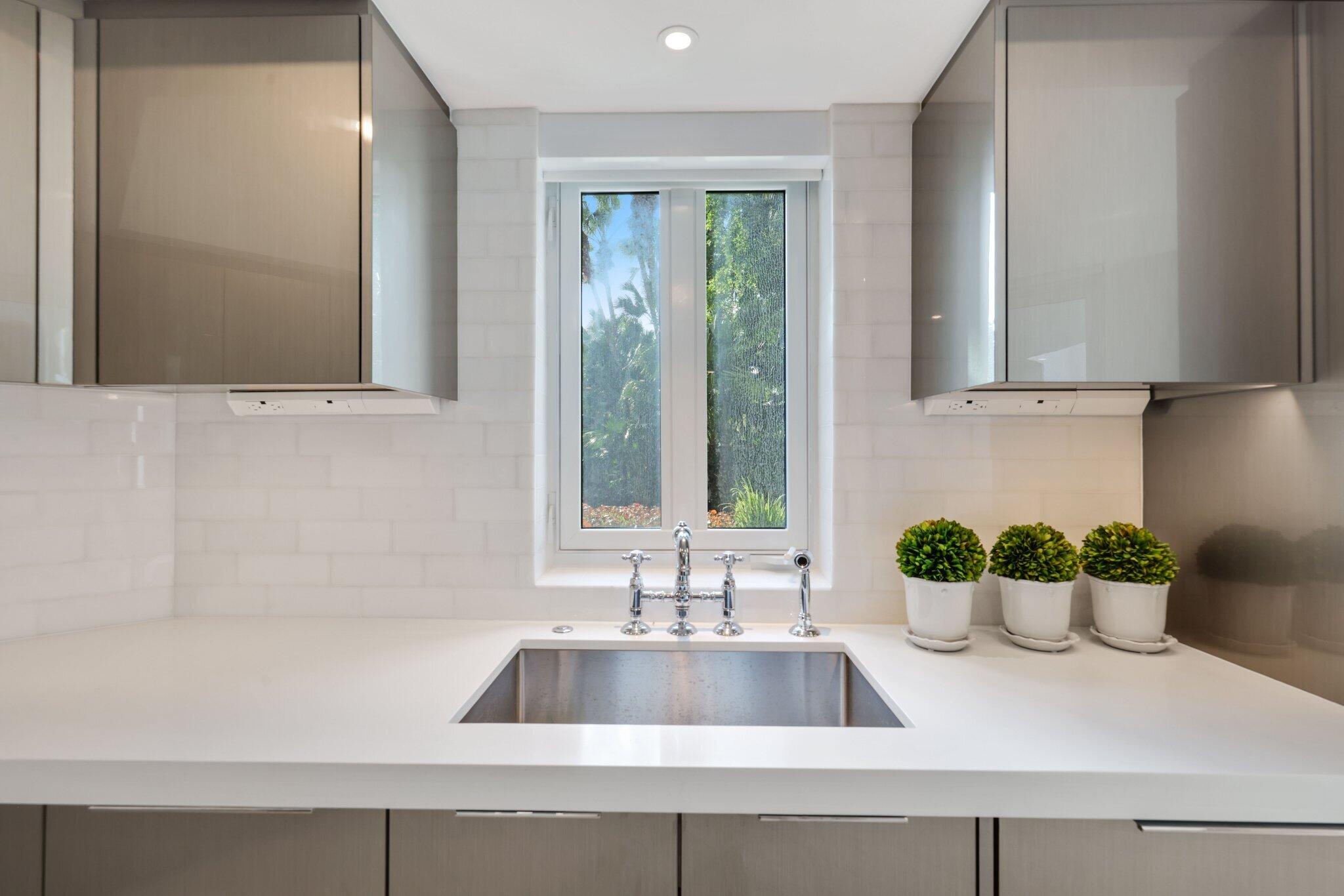 100 Southeast 5th Avenue, Unit 106 Boca Raton, FL 33432 - Photo 16 of 81 a bathroom with a sink and a window