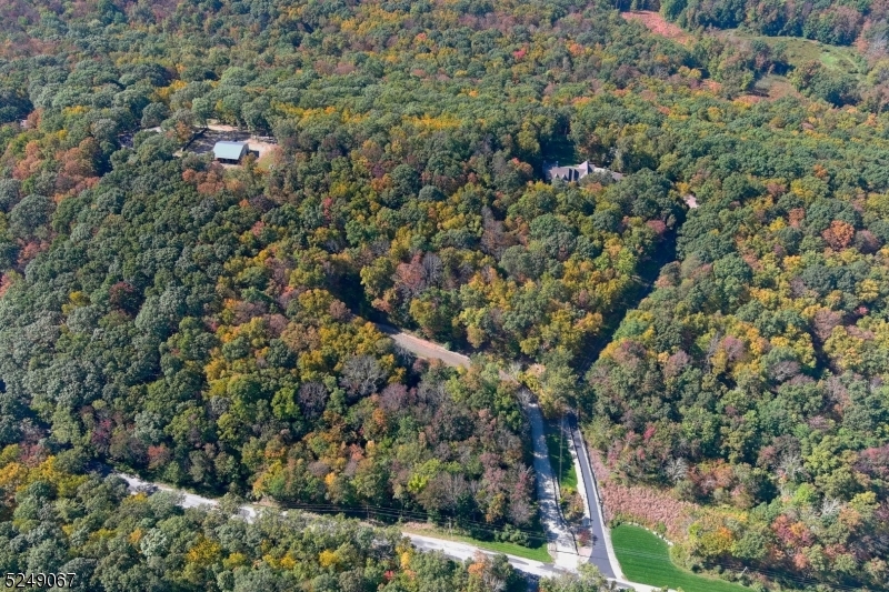 93 Moore Road Wantage, NJ 07461 - Photo 11 of 25 a view of a city with lush green forest