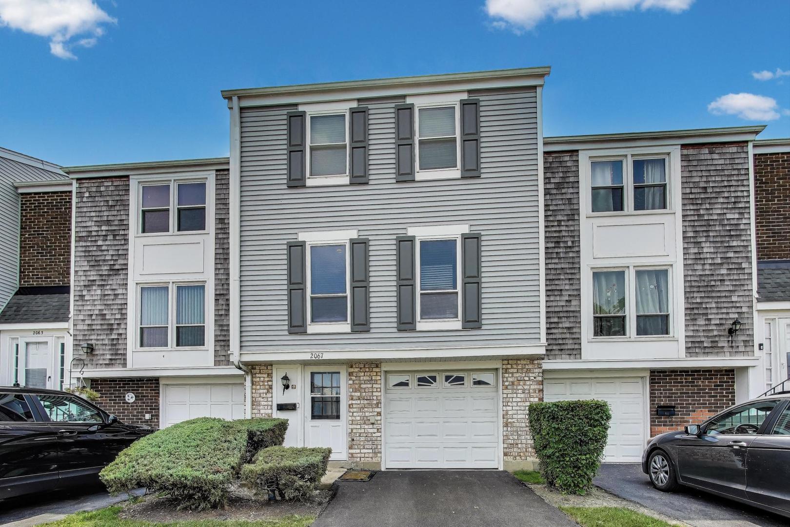 2067 Kettering Road Hoffman Estates, IL 60169 - Photo 1 of 28 a front view of a house with a yard