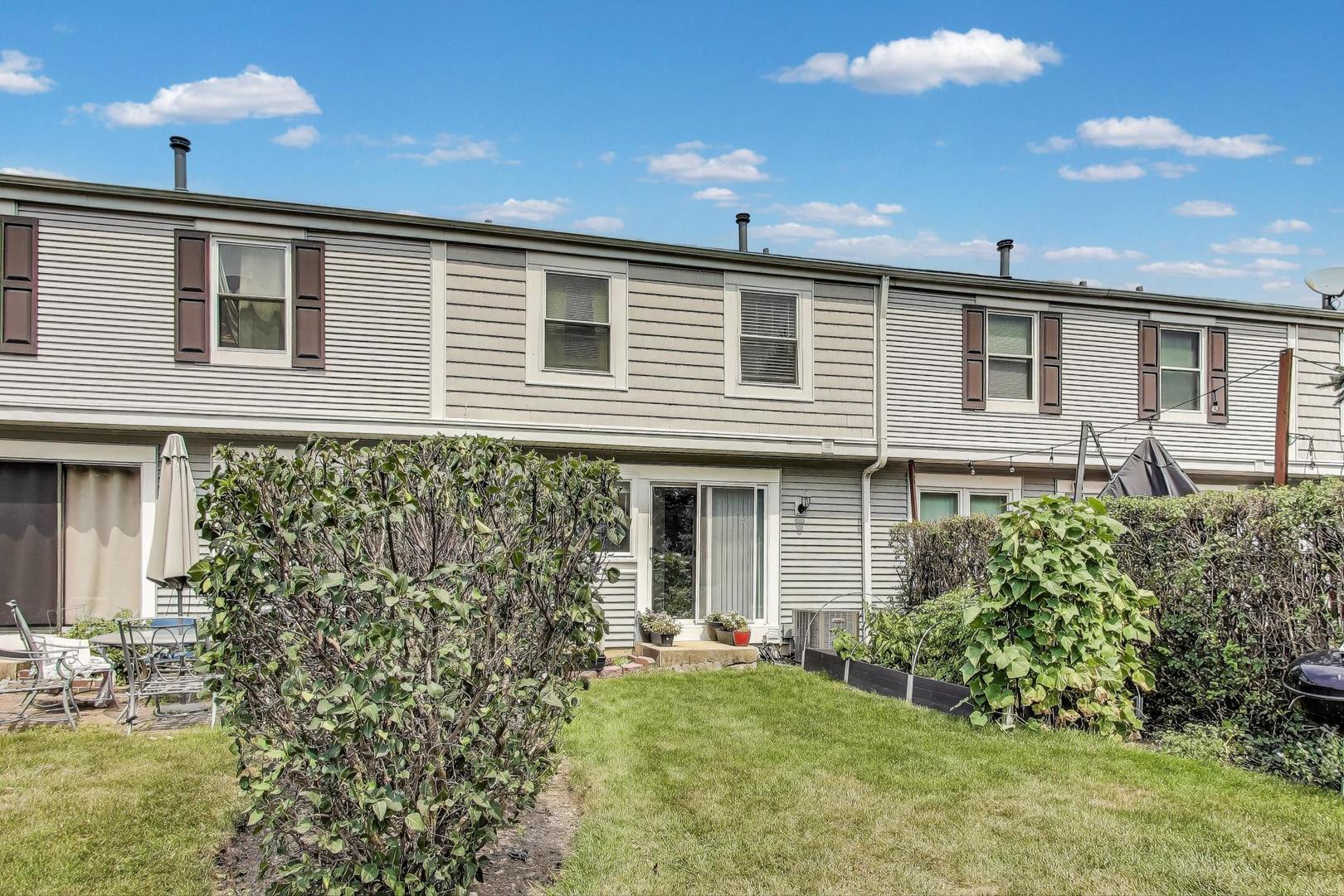 2067 Kettering Road Hoffman Estates, IL 60169 - Photo 24 of 28 a front view of a house with garden