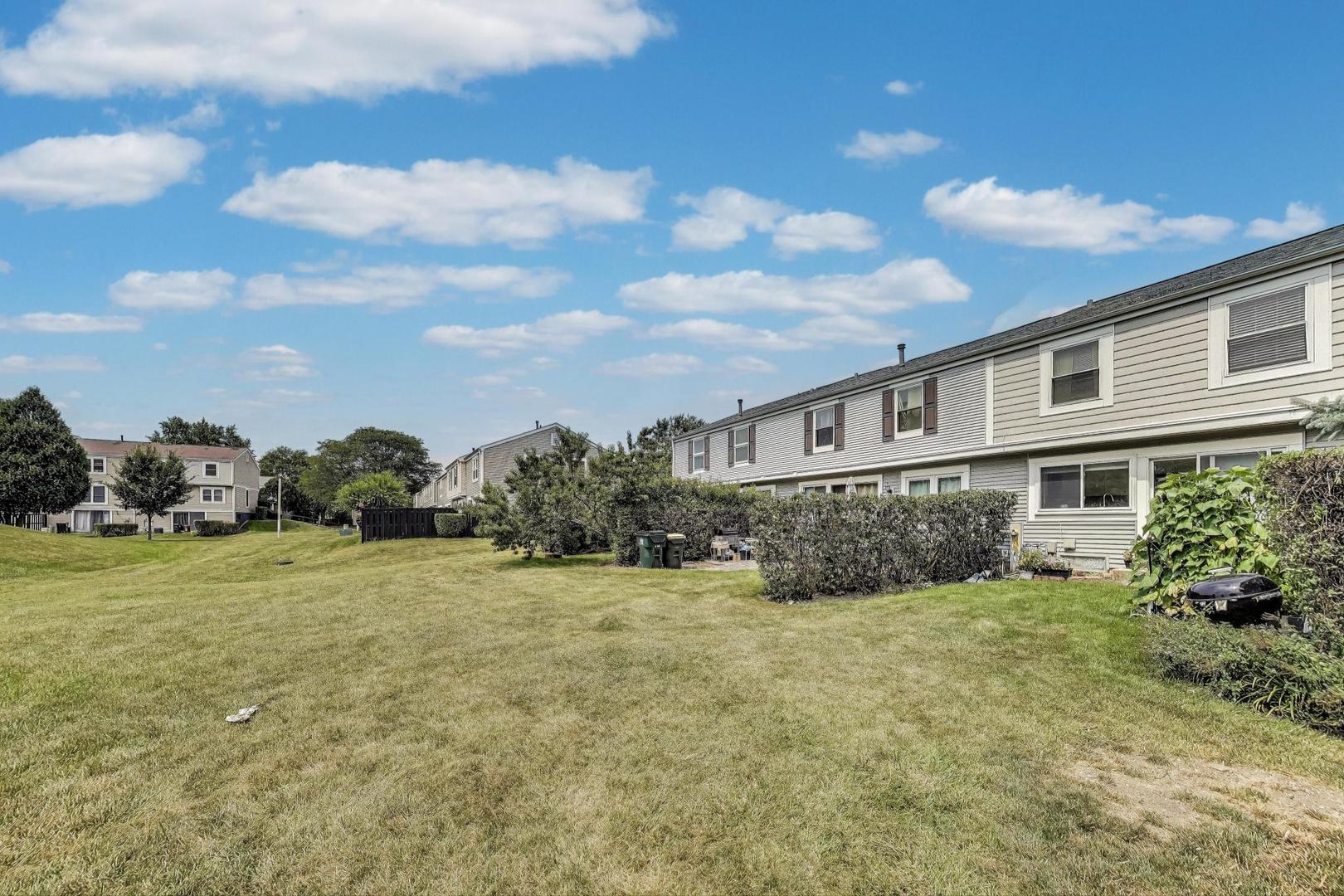 2067 Kettering Road Hoffman Estates, IL 60169 - Photo 27 of 28 a view of a house with a yard