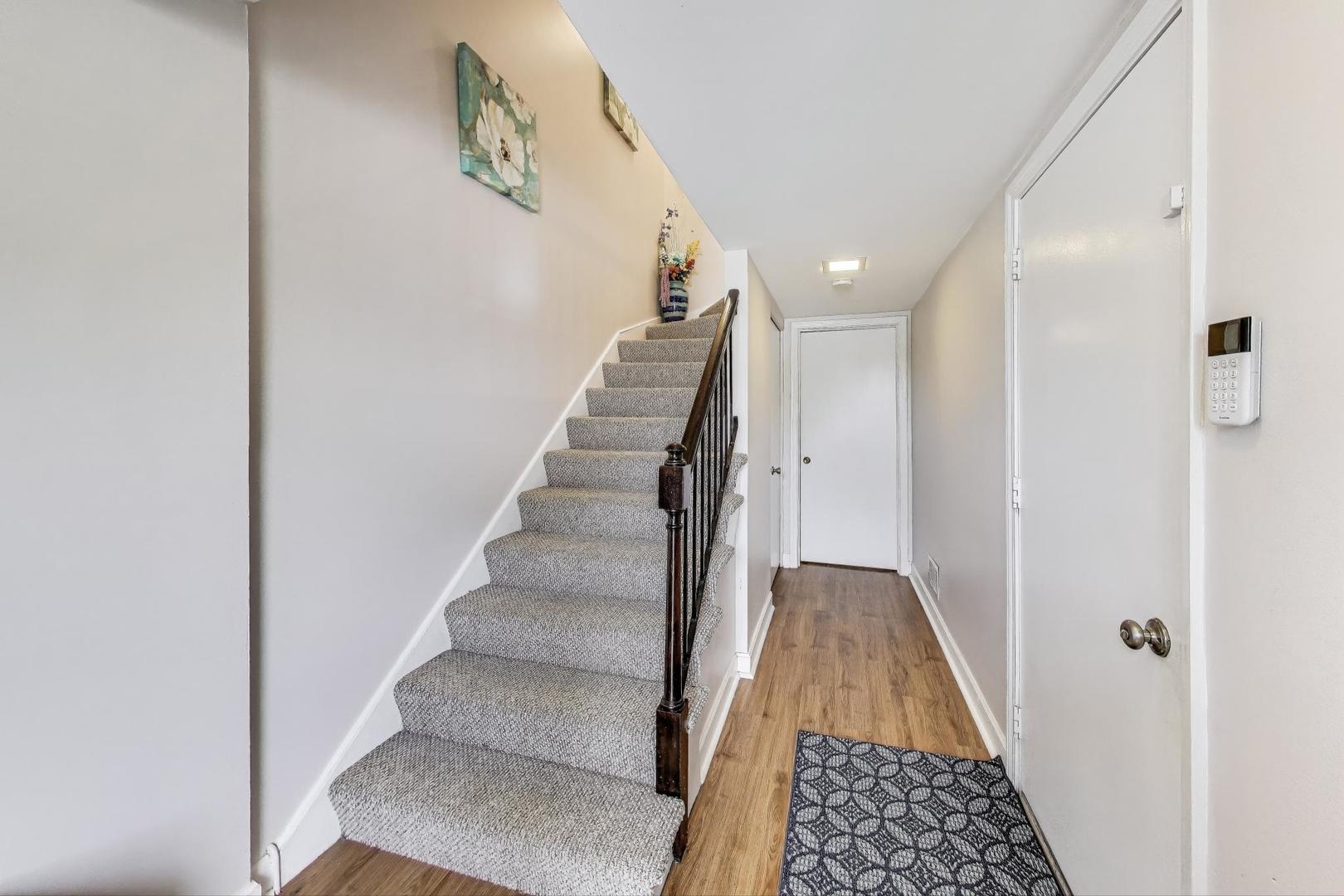 2067 Kettering Road Hoffman Estates, IL 60169 - Photo 3 of 28 a view of entryway with wooden floor