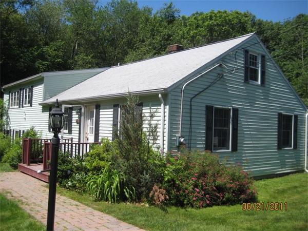 82 Teele Road Bolton, MA 01740 - Photo 1 of 12 a front view of a house with garden