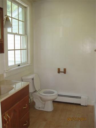82 Teele Road Bolton, MA 01740 - Photo 12 of 12 a bathroom with a toilet a sink and a window