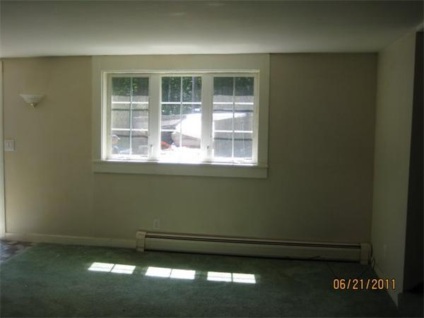82 Teele Road Bolton, MA 01740 - Photo 6 of 12 a view of a livingroom with an empty space and window