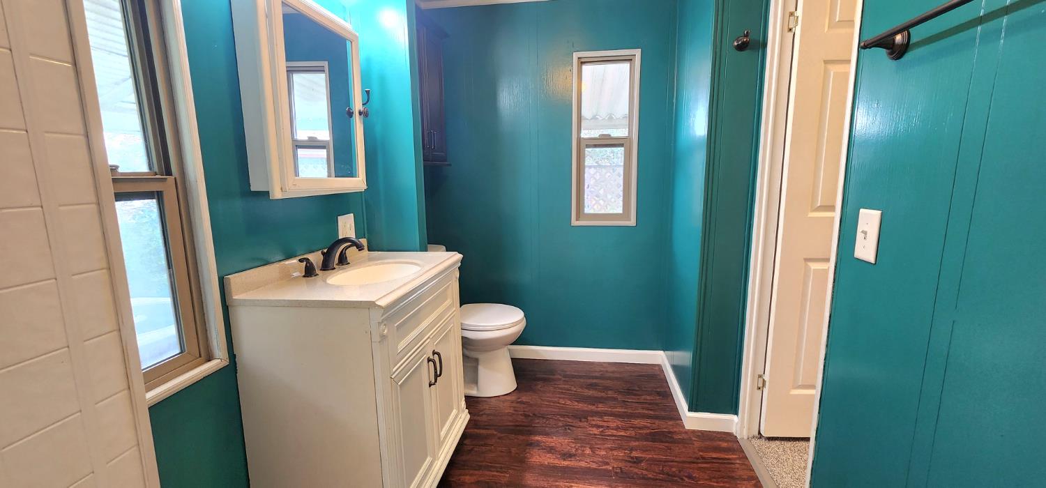 1300 West Olson Avenue, Unit 179 Reedley, CA 93654 - Photo 26 of 39 a bathroom with a sink and a mirror