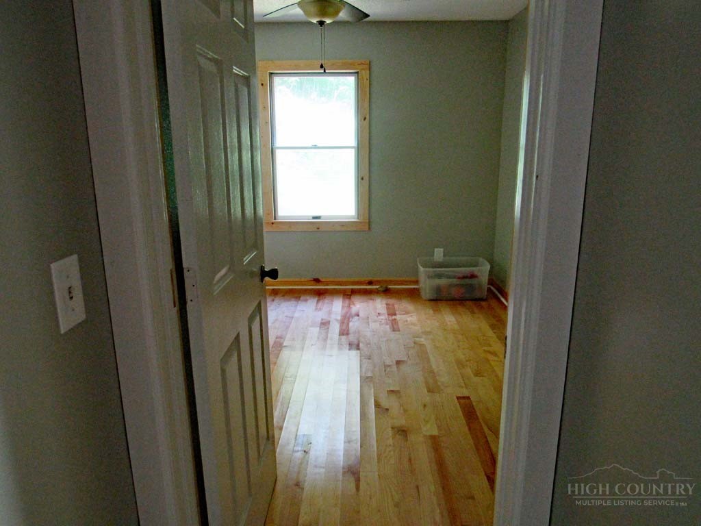 805 Ed Little Road Warrensville, NC 28693 - Photo 41 of 49 a bathroom with a window