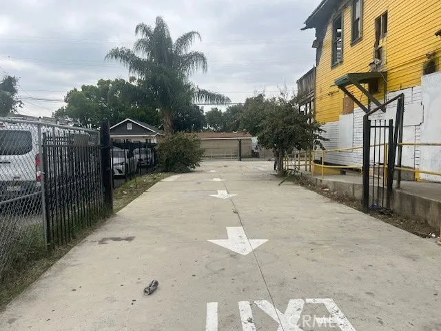 a view of a street with a building in the background