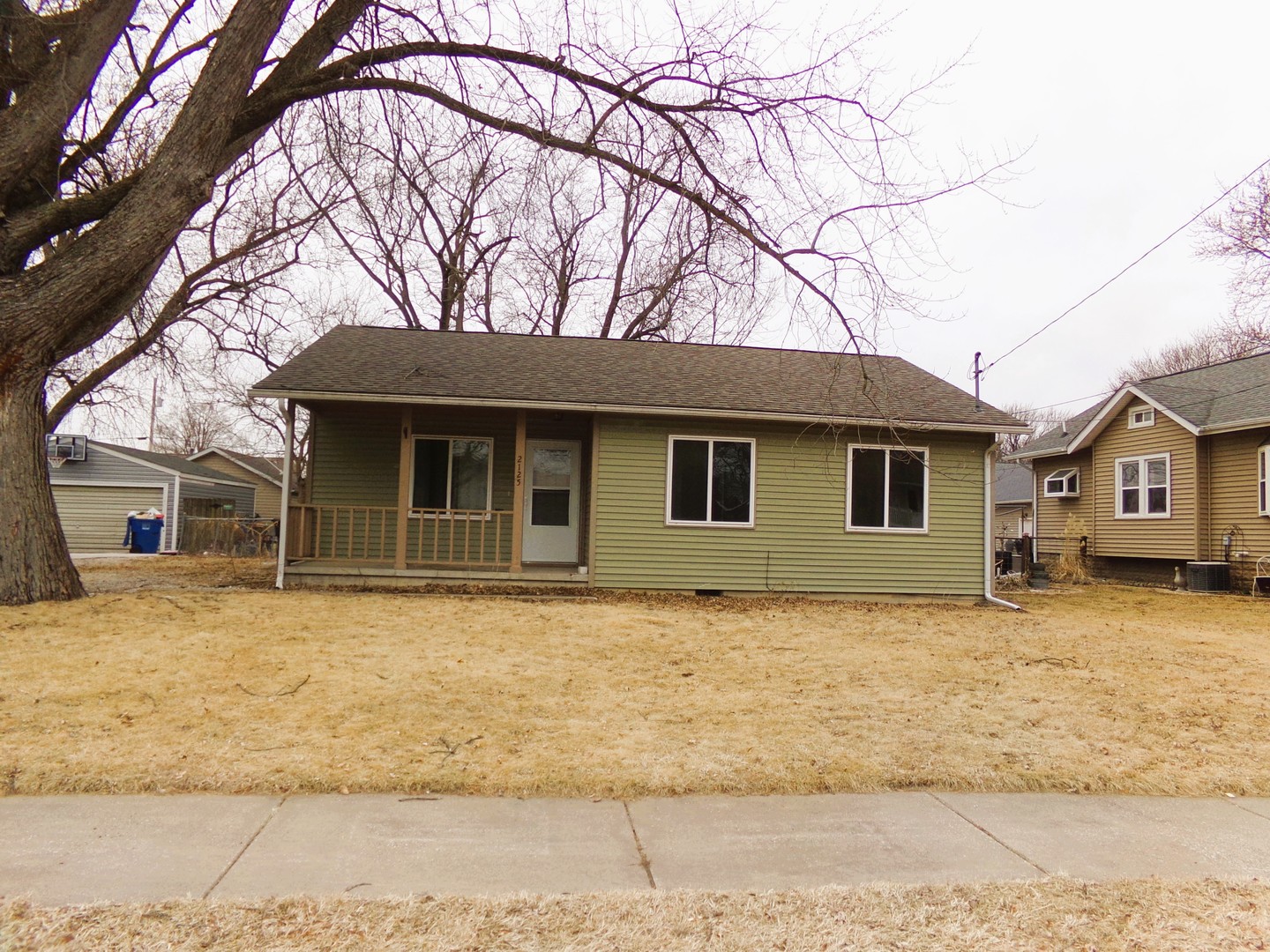 2125 44th Street Moline, IL 61265 - Photo 1 of 12 a front view of a house with a yard