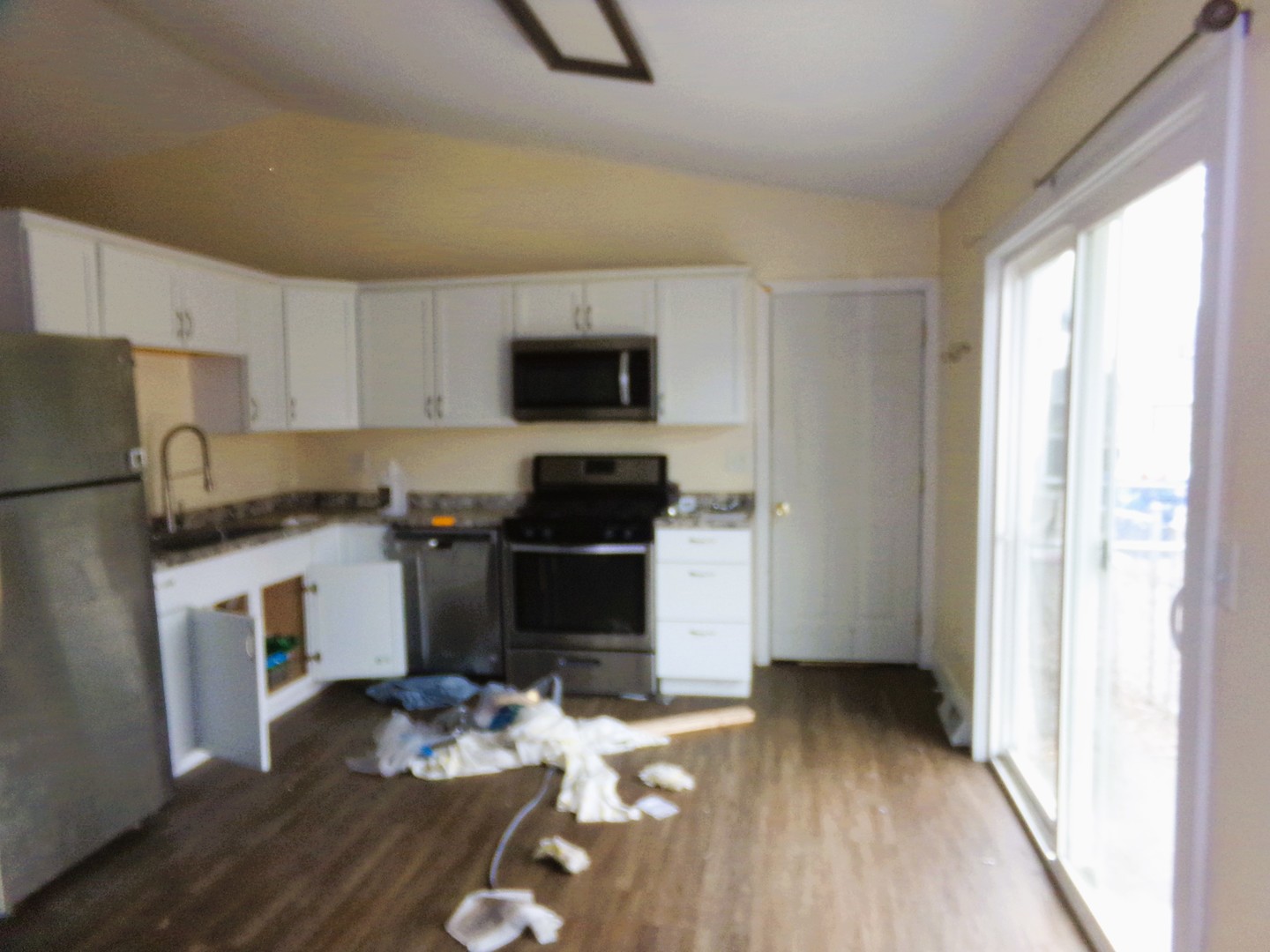 2125 44th Street Moline, IL 61265 - Photo 3 of 12 a kitchen with a refrigerator and a stove top oven
