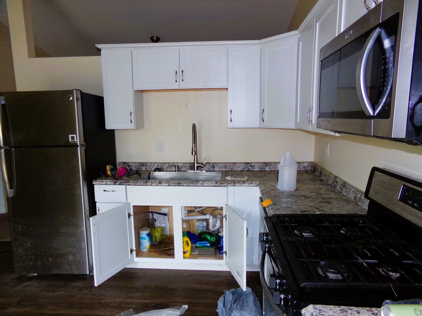 2125 44th Street Moline, IL 61265 - Photo 5 of 12 a kitchen with stainless steel appliances granite countertop a refrigerator and a stove top oven