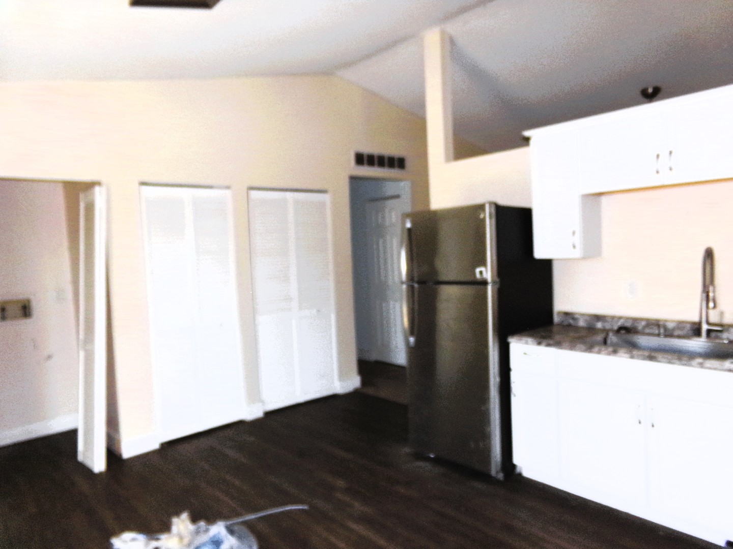2125 44th Street Moline, IL 61265 - Photo 6 of 12 a kitchen with a refrigerator and a wooden floor