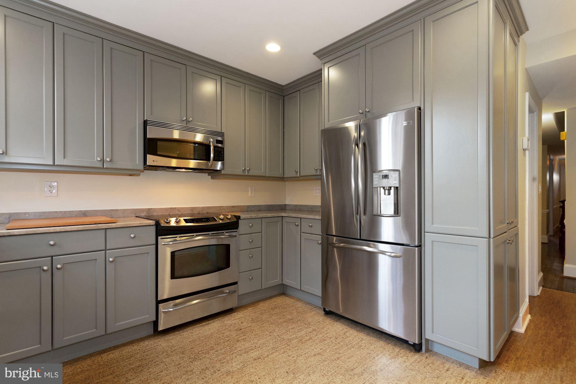 315 Constitution Avenue Northeast Washington, DC 20002 - Photo 16 of 32 a kitchen with appliances a sink and cabinets