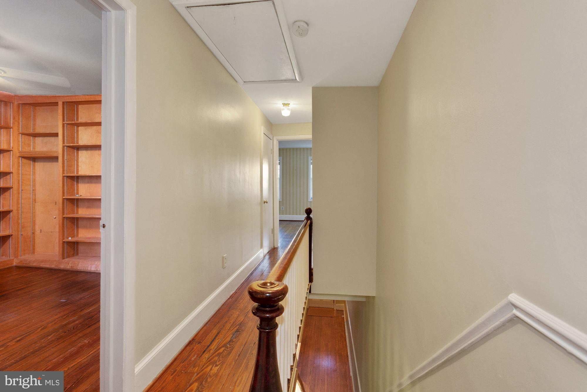 315 Constitution Avenue Northeast Washington, DC 20002 - Photo 19 of 32 a view of hallway with stairs and wooden floor