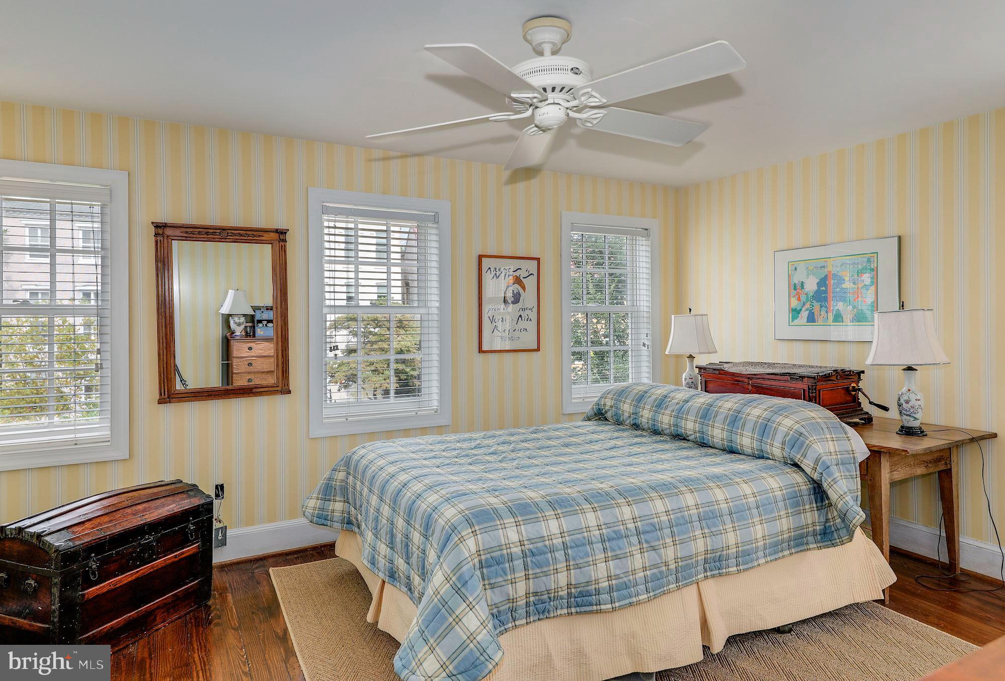 315 Constitution Avenue Northeast Washington, DC 20002 - Photo 21 of 32 a bedroom with a bed and a chandelier