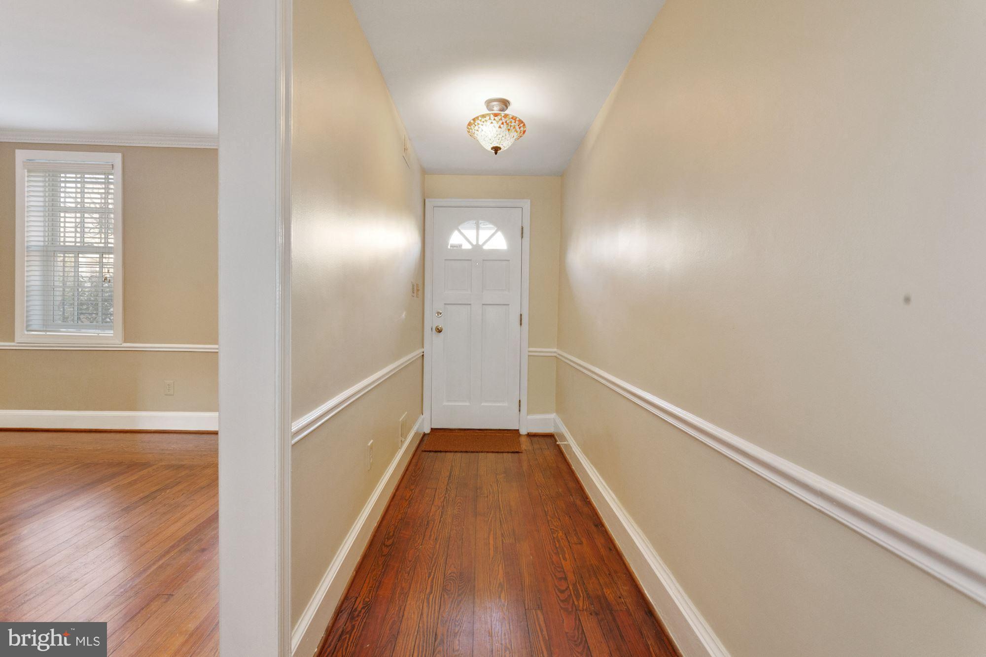 315 Constitution Avenue Northeast Washington, DC 20002 - Photo 3 of 32 a view of a hallway view with wooden floor and staircase