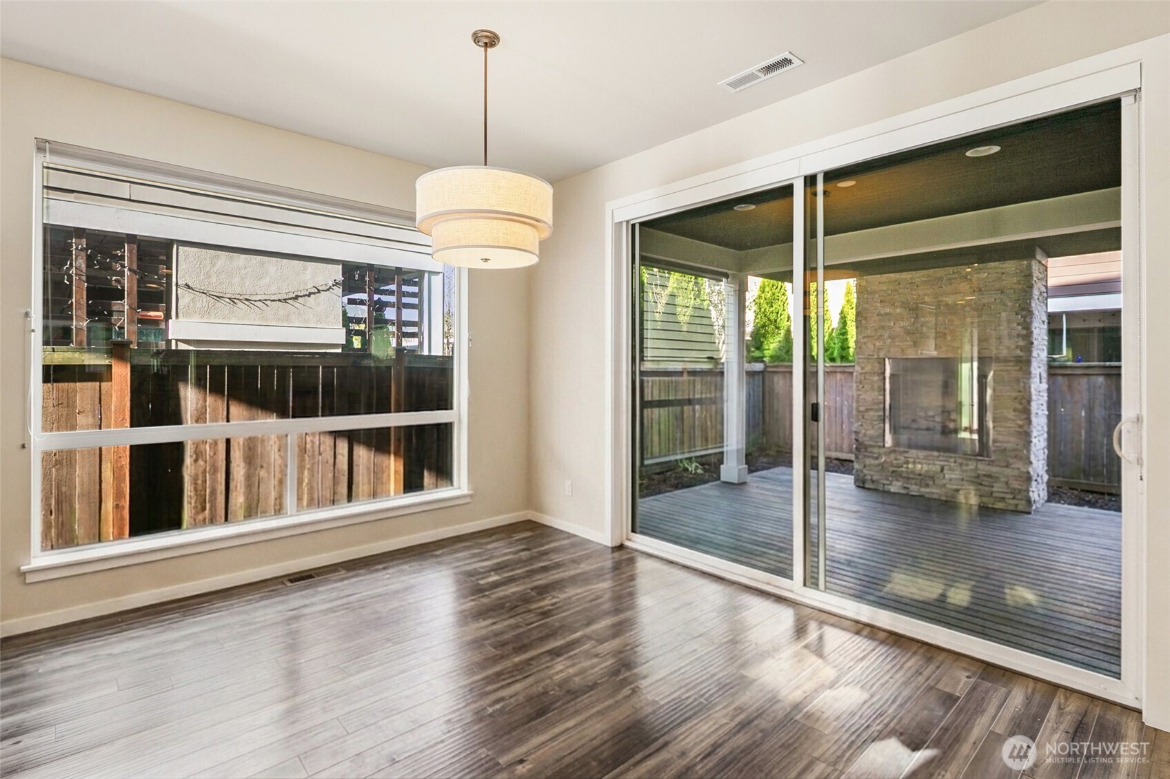 17227 39th Drive Southeast Bothell, WA 98012 - Photo 6 of 22 a view of an empty room with window wooden floor and door