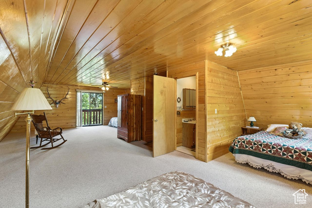 1180 Oak Road Coalville, UT 84017 - Photo 15 of 25 Carpeted bedroom with wood ceiling, access to exterior, and wood walls