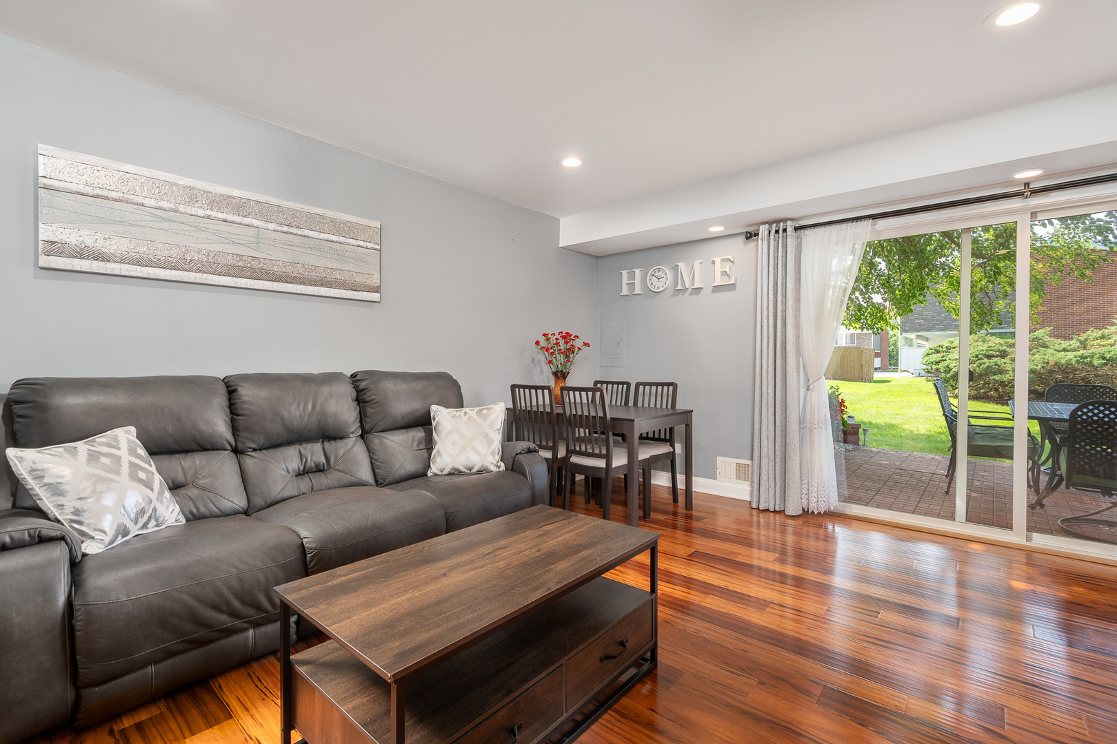 12 Cour Monnet Palos Hills, IL 60465 - Photo 4 of 27 a living room with furniture and a floor to ceiling window