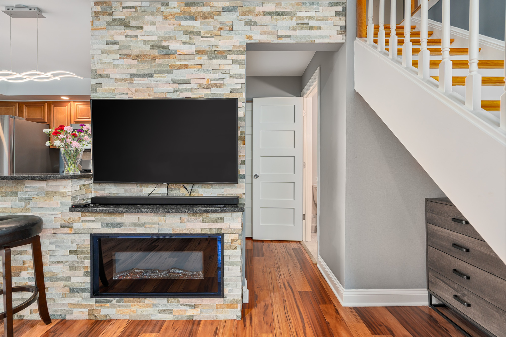 12 Cour Monnet Palos Hills, IL 60465 - Photo 5 of 27 a living room with a fireplace and a flat screen tv