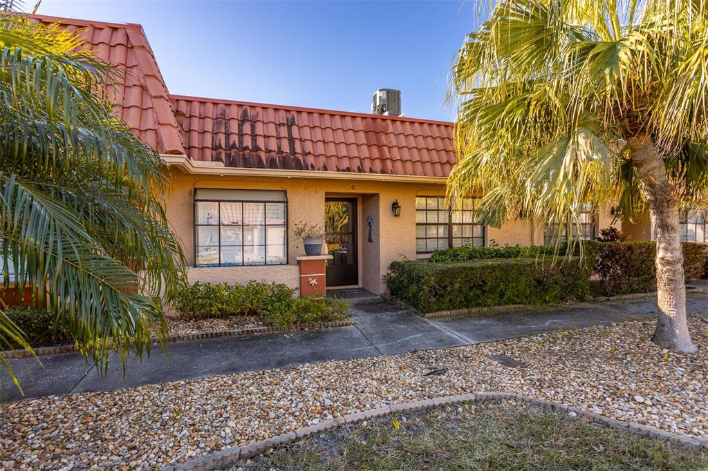 19029 US Highway 19 North, Unit 10C Clearwater, FL 33764 - Photo 2 of 61 a view of a house with a garden