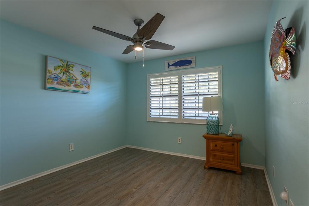 19029 US Highway 19 North, Unit 10C Clearwater, FL 33764 - Photo 21 of 61 wooden floor in an empty room with a window