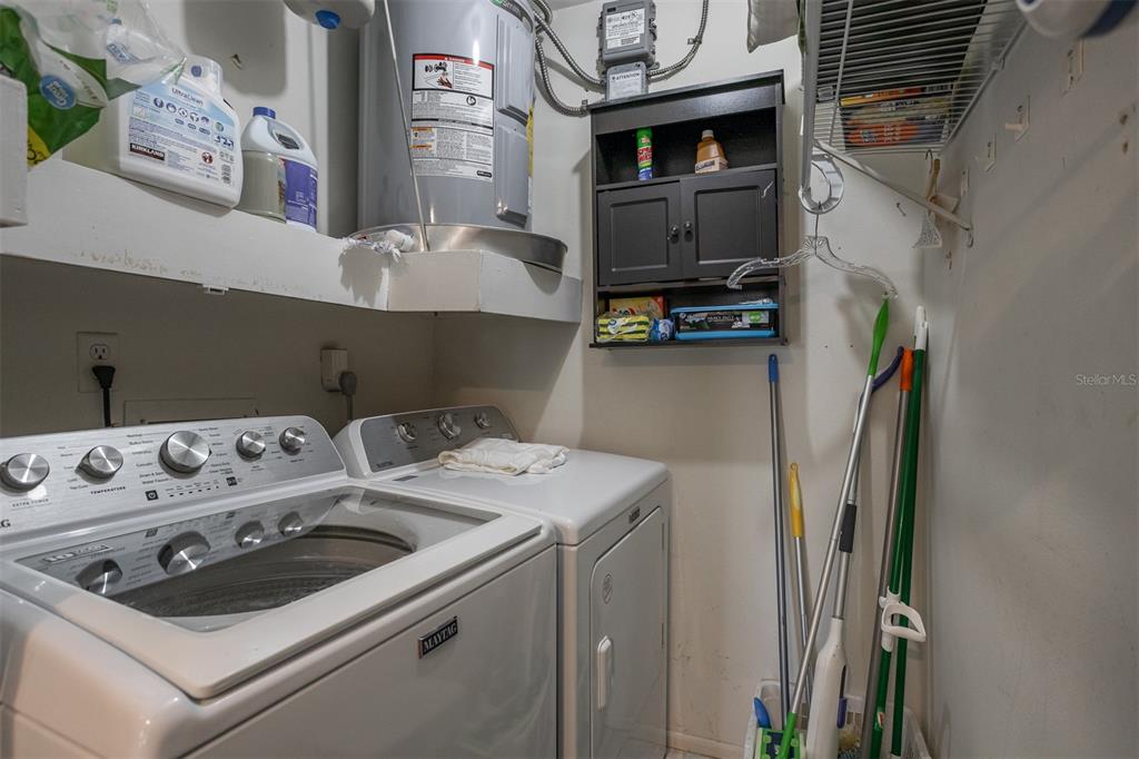 19029 US Highway 19 North, Unit 10C Clearwater, FL 33764 - Photo 25 of 61 a utility room with dryer and washer